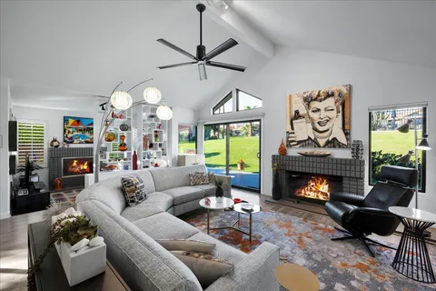 a aerial view of a house with a garden and a yard