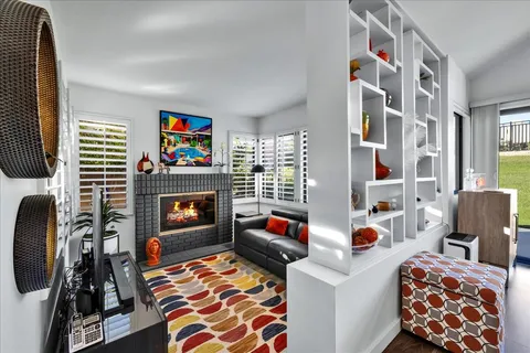 a room with furniture and musical instruments