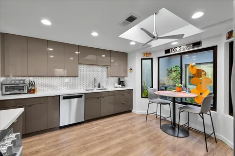 a kitchen with a sink stove and microwave