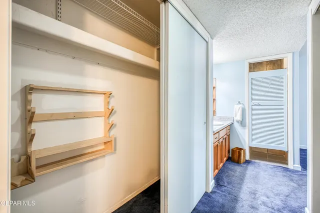 a view of an empty room and a window