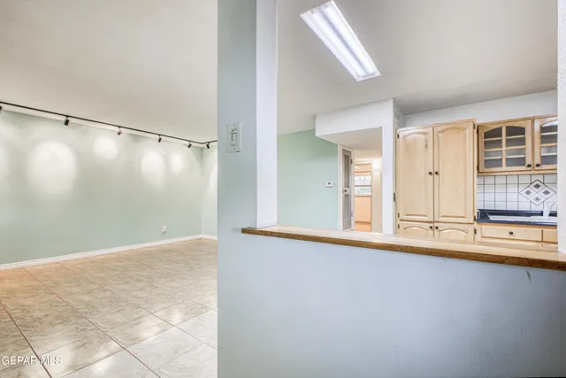 a view of a bathroom with tub and mirror