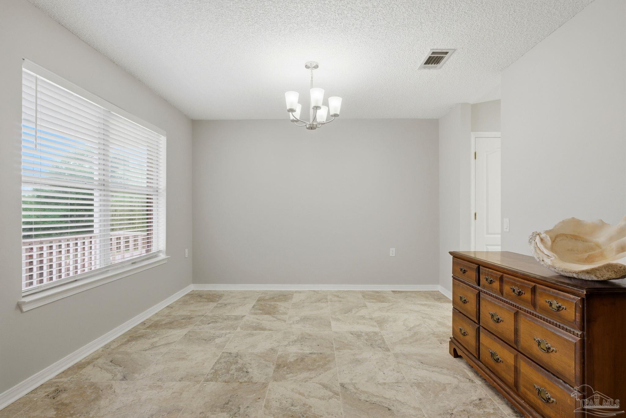 10120 Crest Ridge Drive Pensacola, FL 32514 - Photo 12 of 38 wooden floor in an empty room with a window