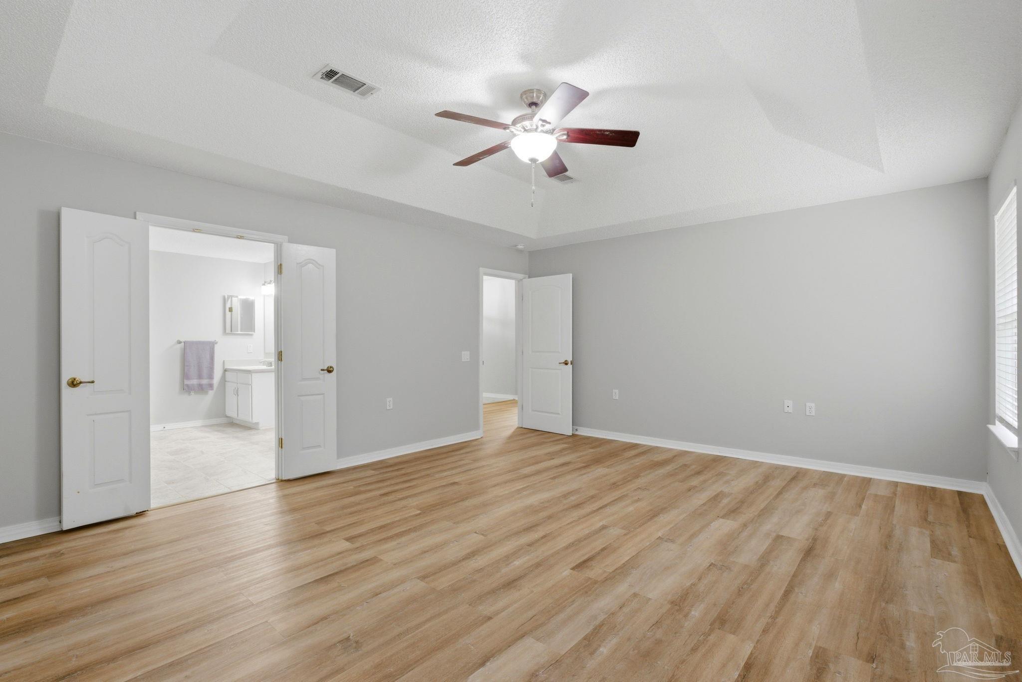 10120 Crest Ridge Drive Pensacola, FL 32514 - Photo 19 of 38 a view of an empty room and wooden floor