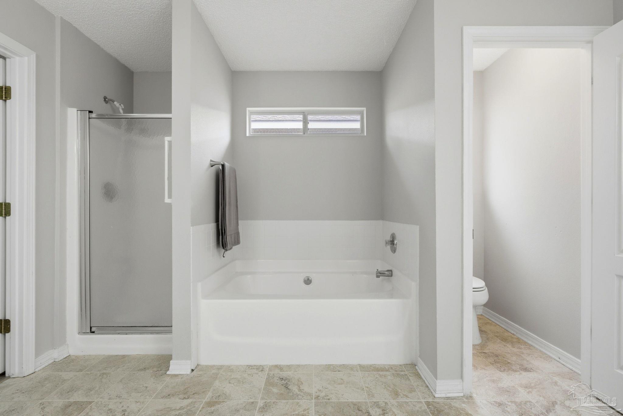 10120 Crest Ridge Drive Pensacola, FL 32514 - Photo 21 of 38 a white bath tub sitting next to a shower