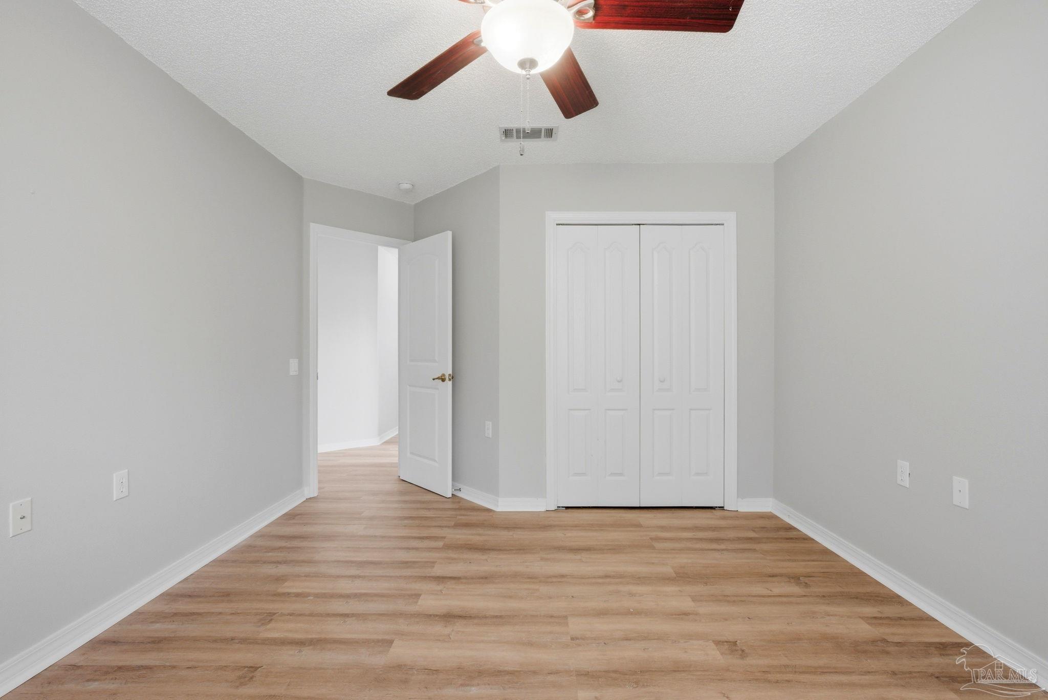 10120 Crest Ridge Drive Pensacola, FL 32514 - Photo 26 of 38 a view of empty room with wooden floor