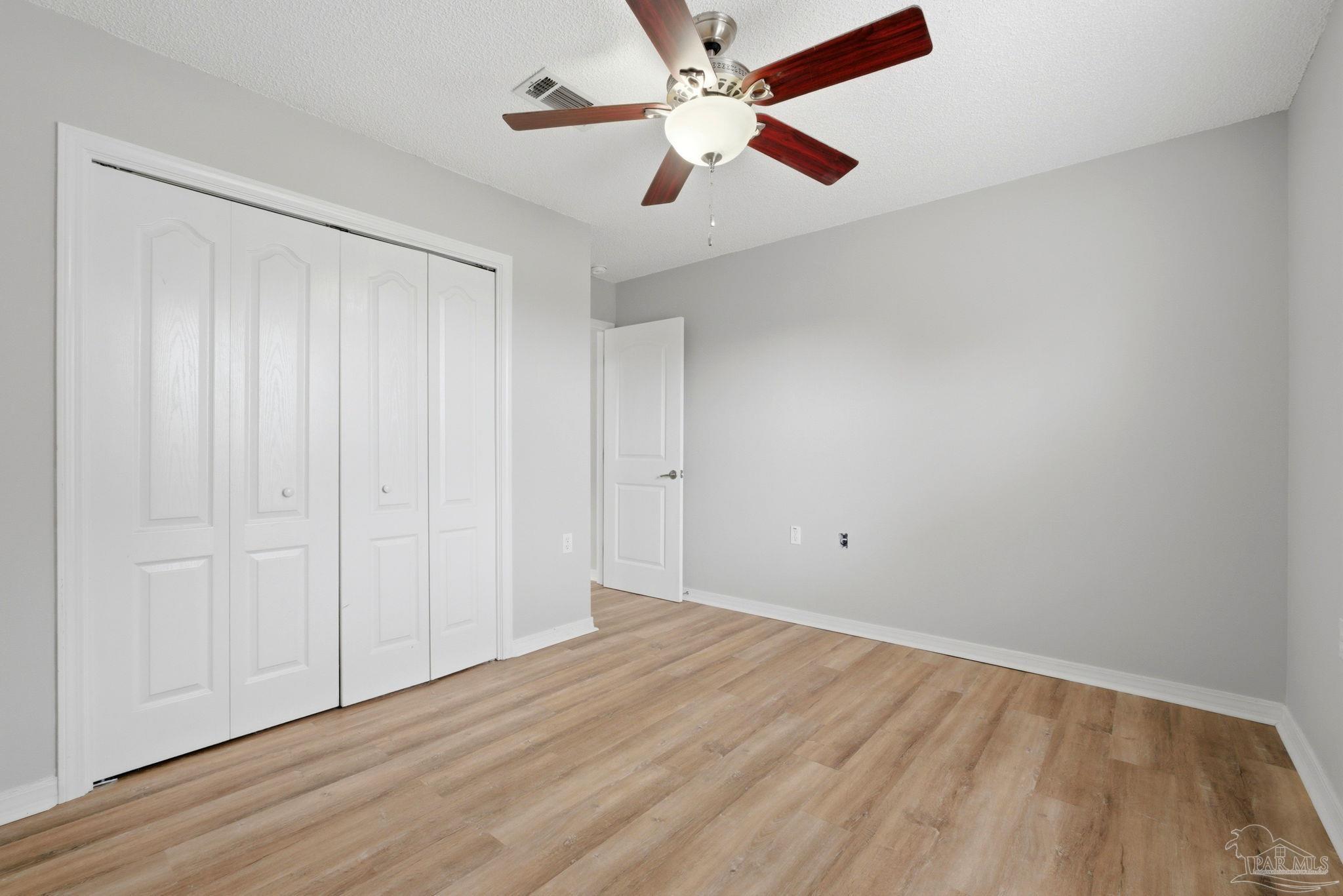 10120 Crest Ridge Drive Pensacola, FL 32514 - Photo 28 of 38 wooden floor in an empty room