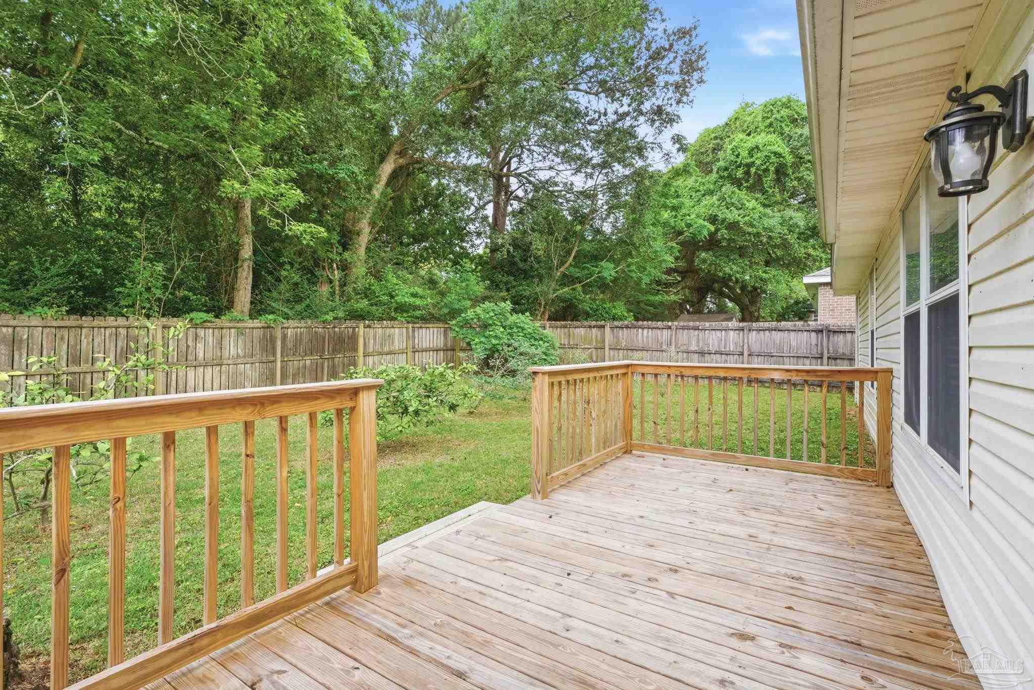10120 Crest Ridge Drive Pensacola, FL 32514 - Photo 32 of 38 a view of balcony with wooden floor and outdoor seating