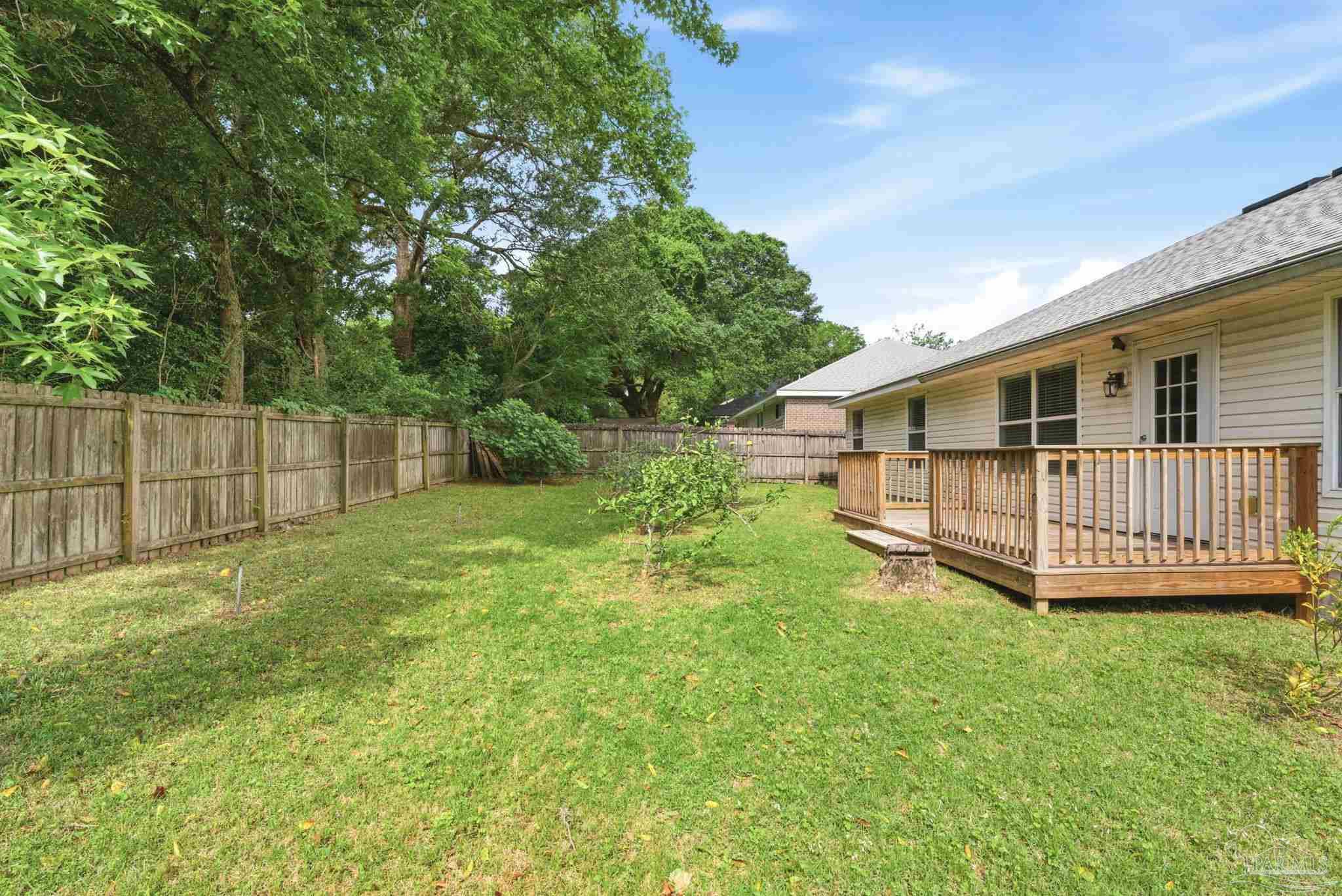 10120 Crest Ridge Drive Pensacola, FL 32514 - Photo 35 of 38 a view of a house with a yard and sitting area