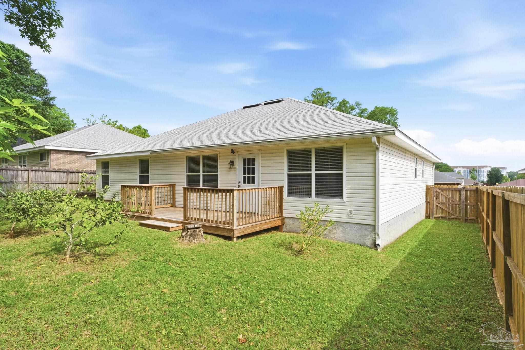 10120 Crest Ridge Drive Pensacola, FL 32514 - Photo 36 of 38 a view of a house with a yard and sitting area