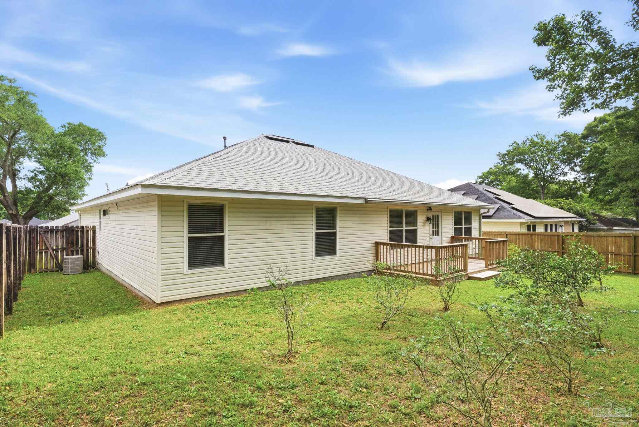 10120 Crest Ridge Drive Pensacola, FL 32514 - Photo 38 of 38 a front view of house with yard and trees in the background