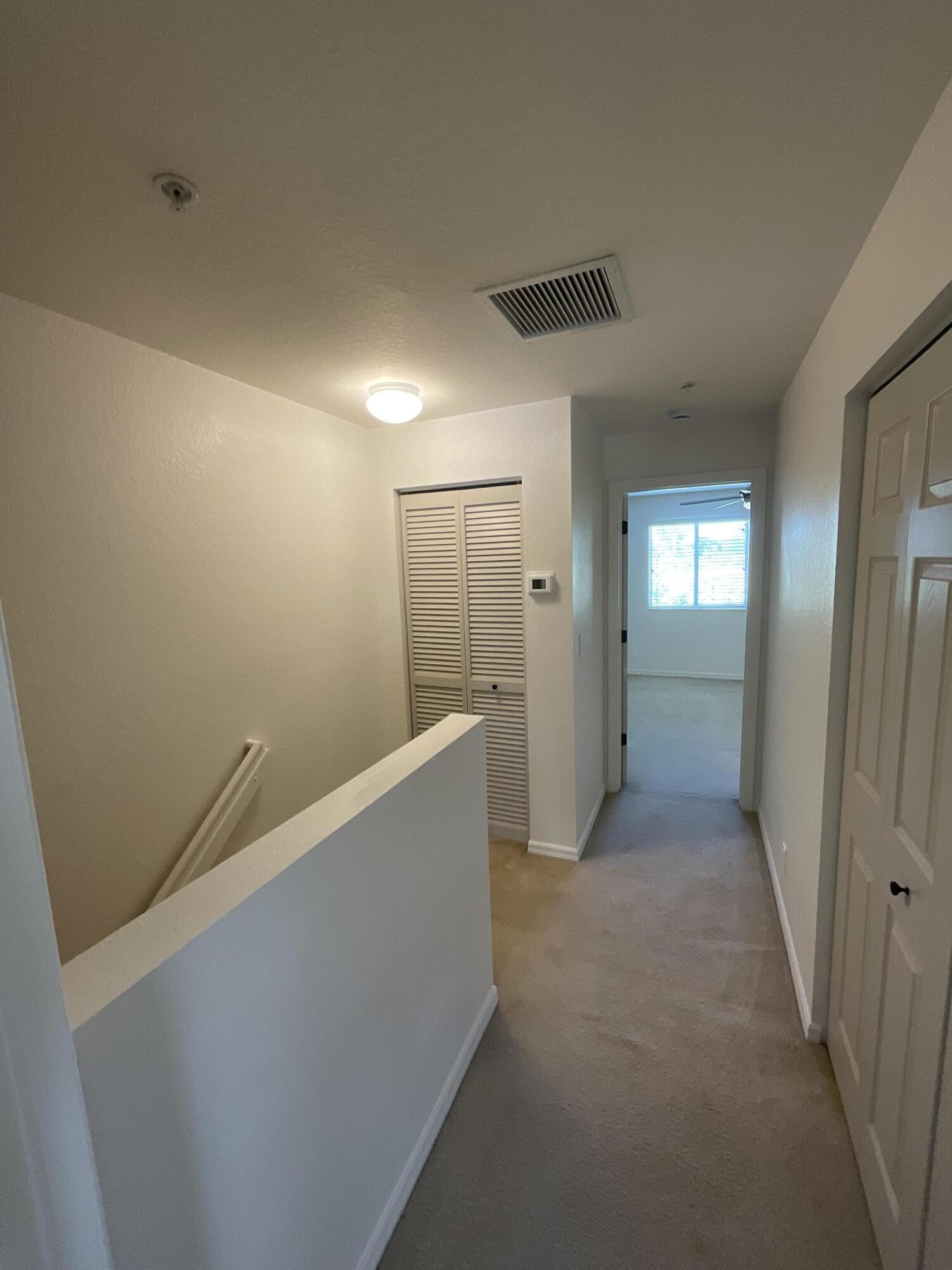 5269 Southeast Jennings Lane Stuart, FL 34997 - Photo 14 of 34 a view of hallway with bathroom