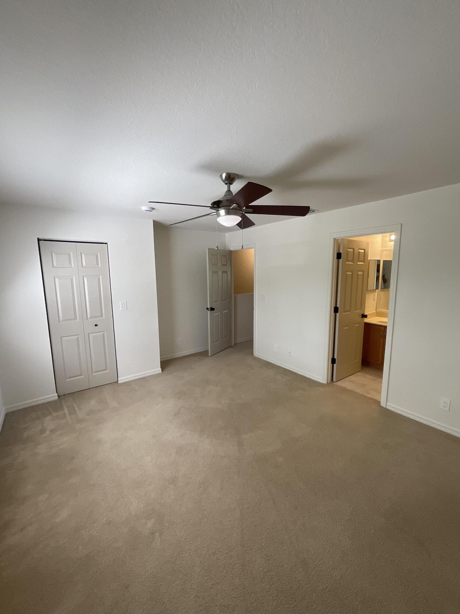 5269 Southeast Jennings Lane Stuart, FL 34997 - Photo 17 of 34 a view of a livingroom with a ceiling fan and window