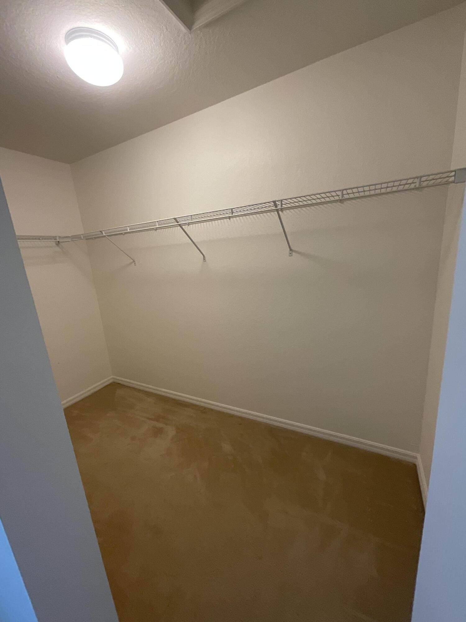 5269 Southeast Jennings Lane Stuart, FL 34997 - Photo 20 of 34 a view of a room with racks on the wall