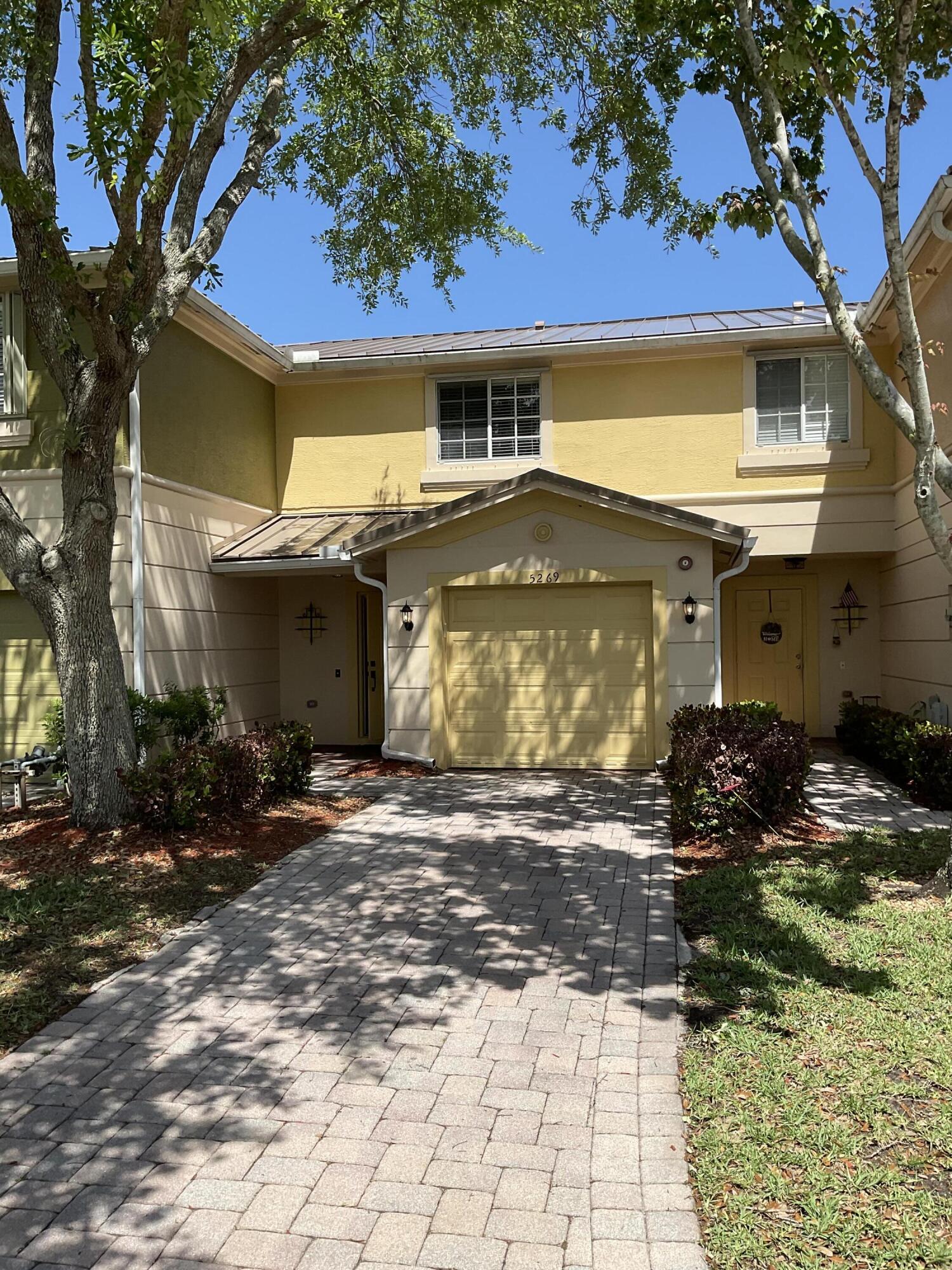 5269 Southeast Jennings Lane Stuart, FL 34997 - Photo 2 of 34 a front view of a house