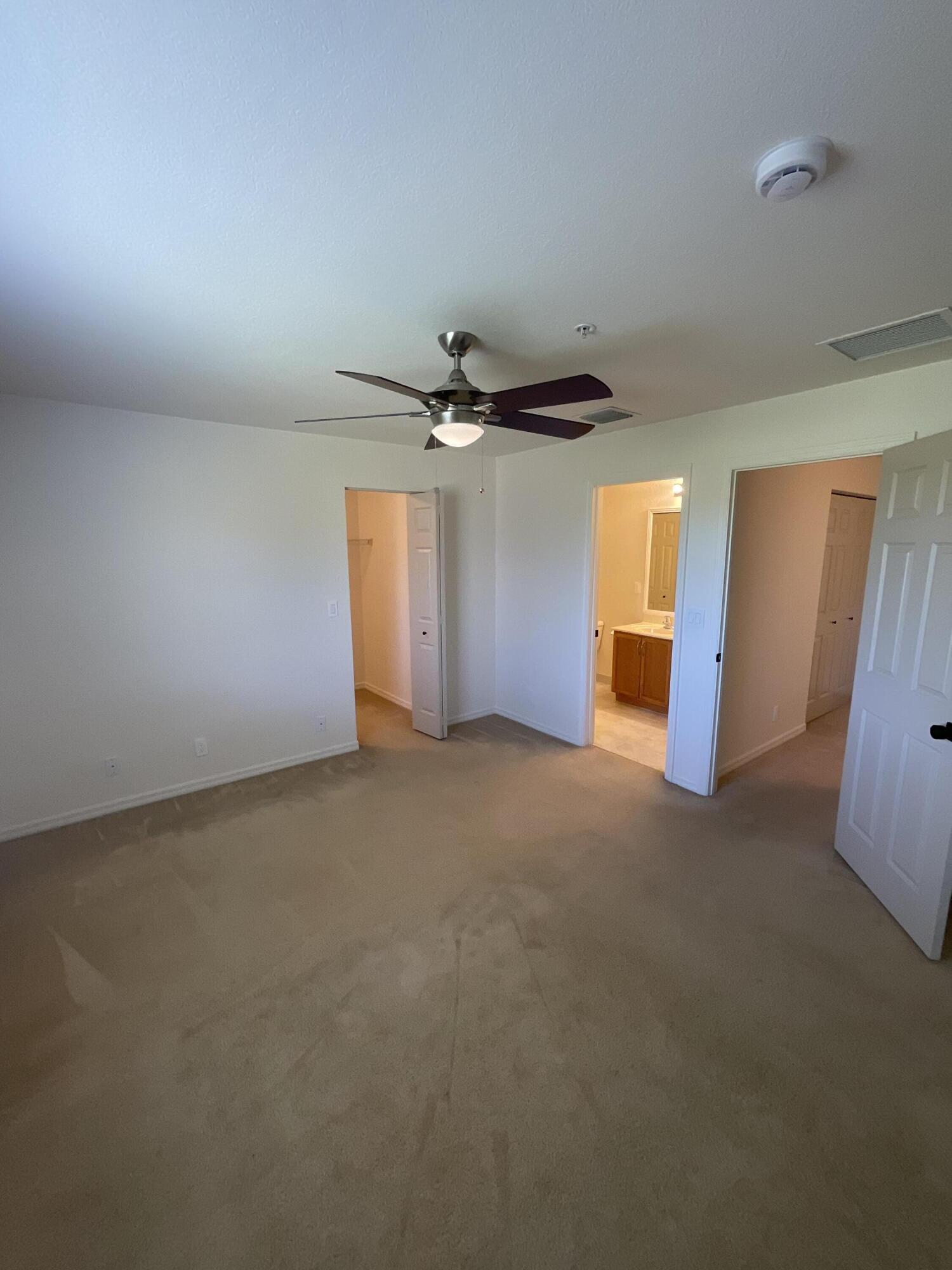 5269 Southeast Jennings Lane Stuart, FL 34997 - Photo 22 of 34 a view of a livingroom with a ceiling fan and window