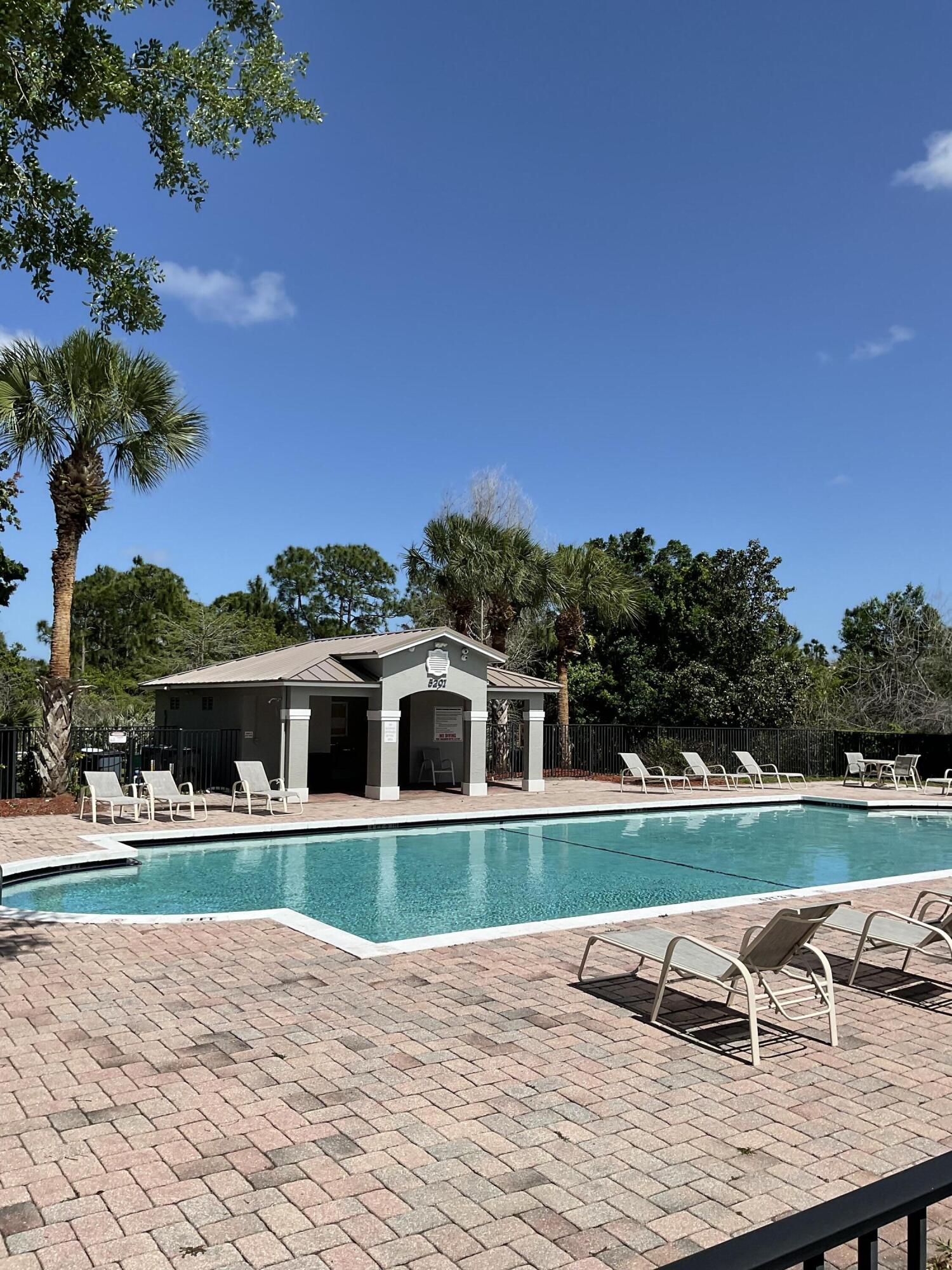 5269 Southeast Jennings Lane Stuart, FL 34997 - Photo 25 of 34 a view of a house with a yard