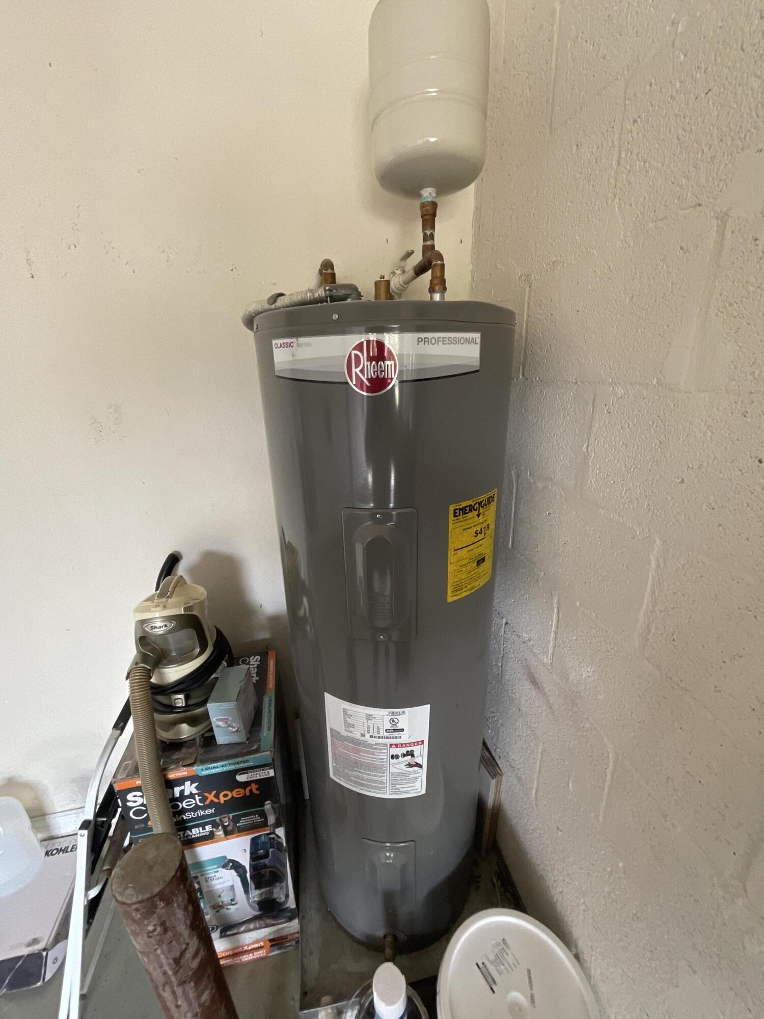5269 Southeast Jennings Lane Stuart, FL 34997 - Photo 29 of 34 a bathroom with a toilet mirror and vanity