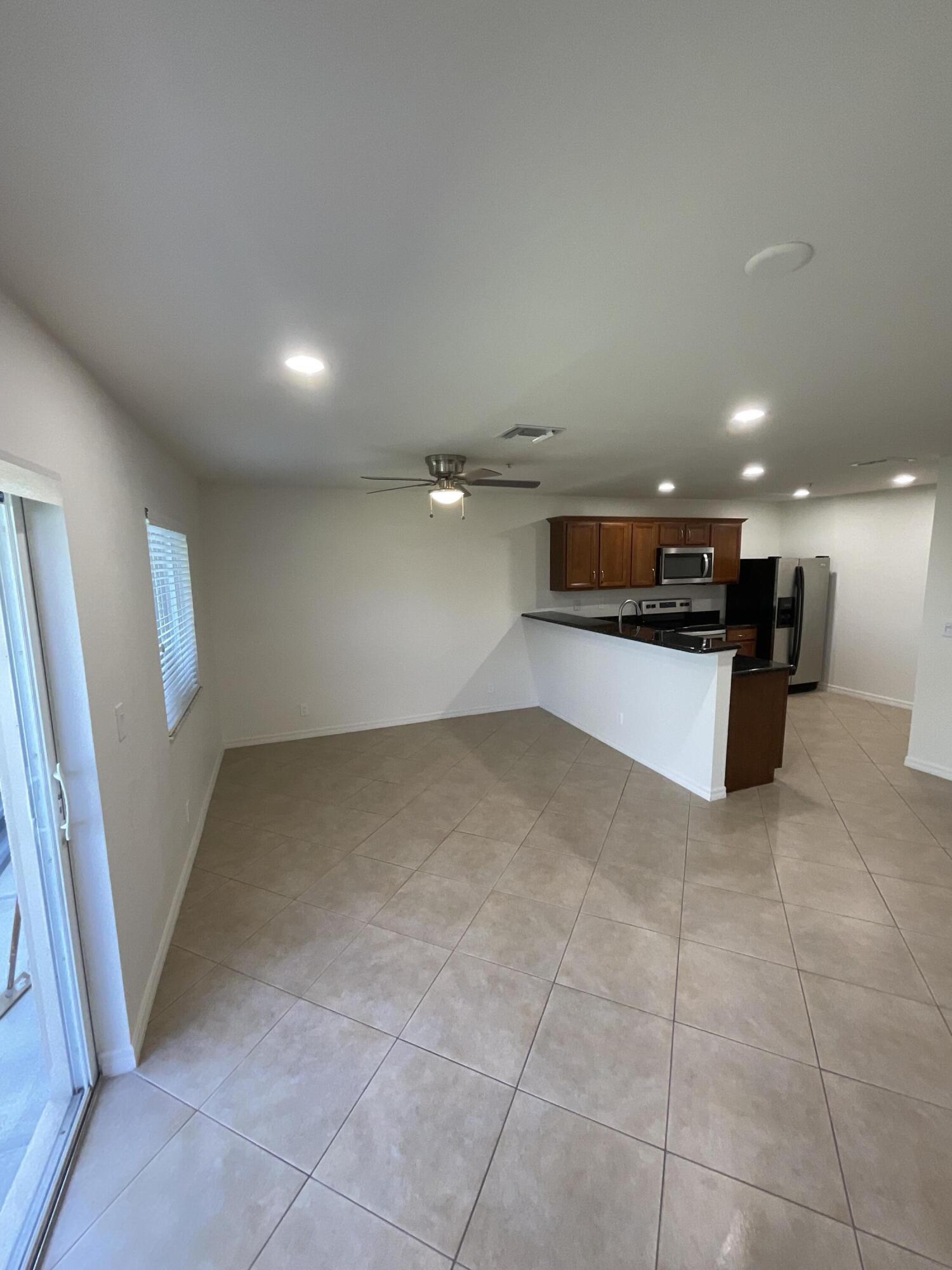 5269 Southeast Jennings Lane Stuart, FL 34997 - Photo 5 of 34 a view of a kitchen with a sink