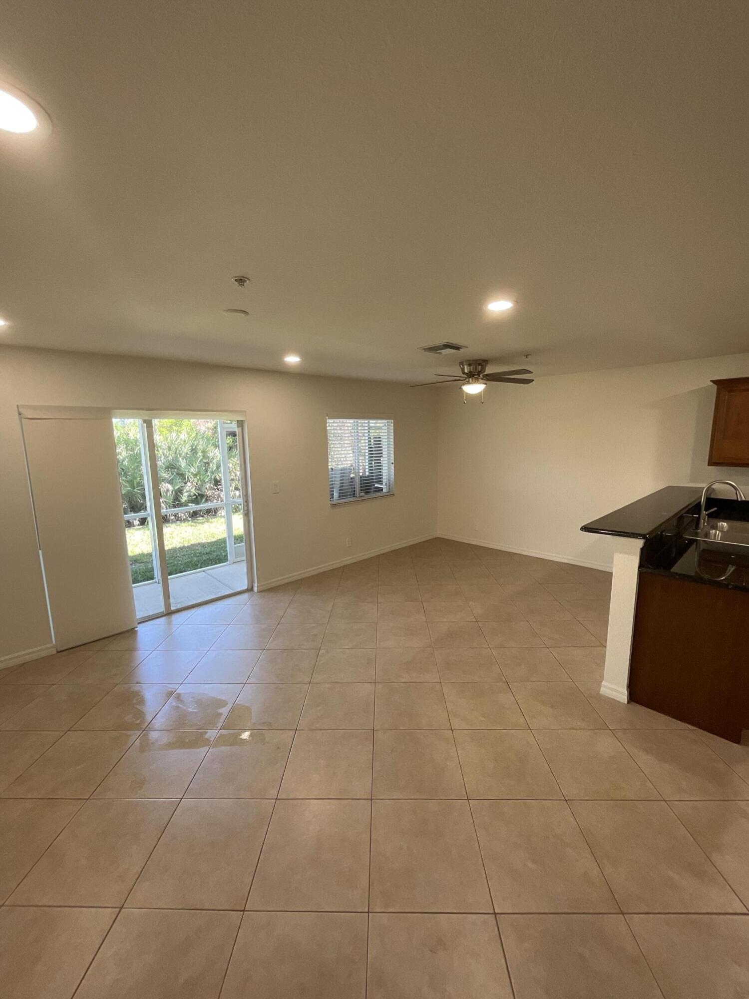 5269 Southeast Jennings Lane Stuart, FL 34997 - Photo 7 of 34 a view of a livingroom with a window