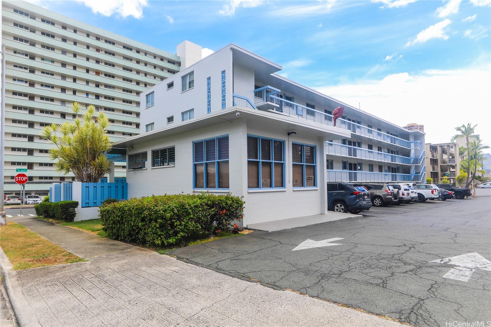 3095 Ala Ilima Street, Unit 204 Honolulu, HI 96818 - Photo 15 of 16 a view of a building with cars parked in front of it