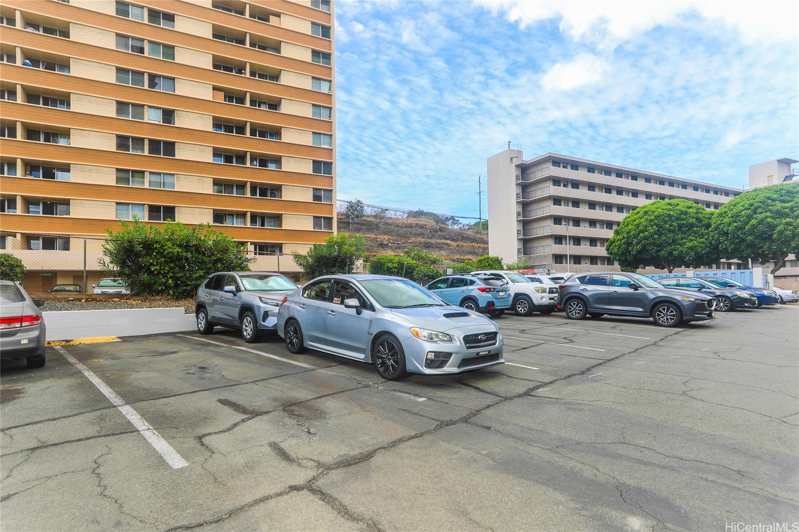 3095 Ala Ilima Street, Unit 204 Honolulu, HI 96818 - Photo 16 of 16 a car parked in front of a building