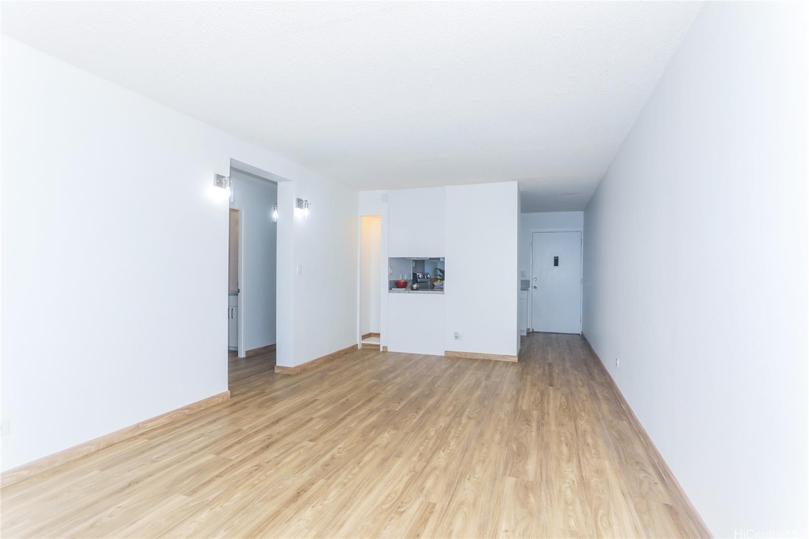 3095 Ala Ilima Street, Unit 204 Honolulu, HI 96818 - Photo 6 of 16 a view of an empty room and wooden floor