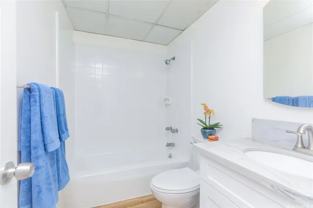 a bathroom with a sink a toilet and bathtub