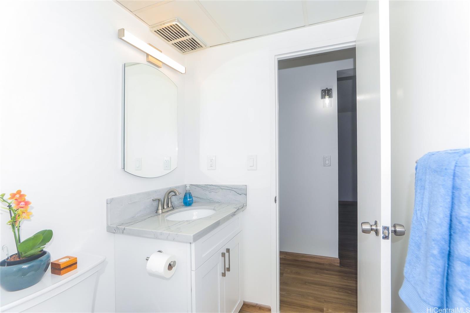 3095 Ala Ilima Street, Unit 204 Honolulu, HI 96818 - Photo 9 of 16 a bathroom with a sink vanity and a mirror