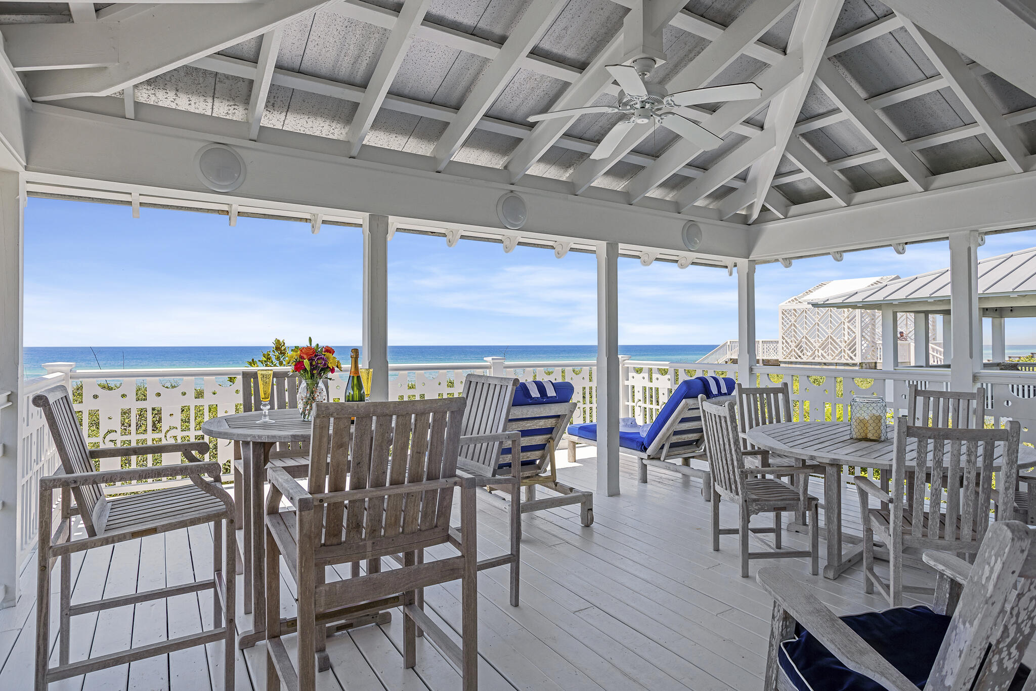 2040 East County Highway 30A Santa Rosa Beach, FL 32459 - Photo 1 of 51 a view of a chairs and table in patio