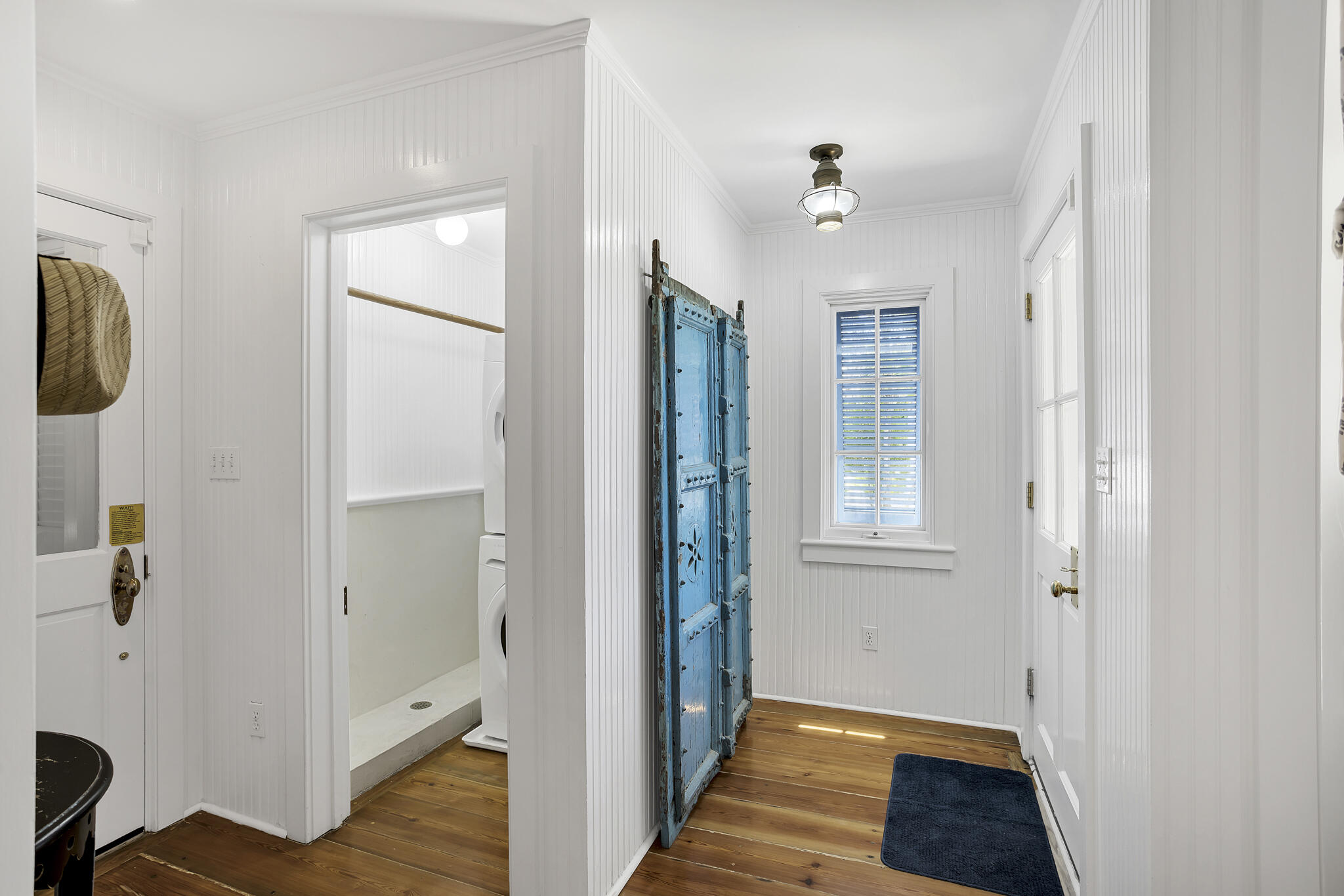 2040 East County Highway 30A Santa Rosa Beach, FL 32459 - Photo 17 of 51 a view of a hallway with wooden floor and closet