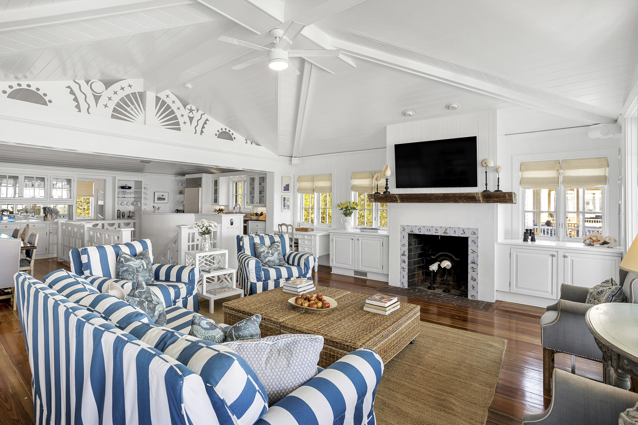 2040 East County Highway 30A Santa Rosa Beach, FL 32459 - Photo 26 of 51 a living room with furniture a flat screen tv and a fireplace