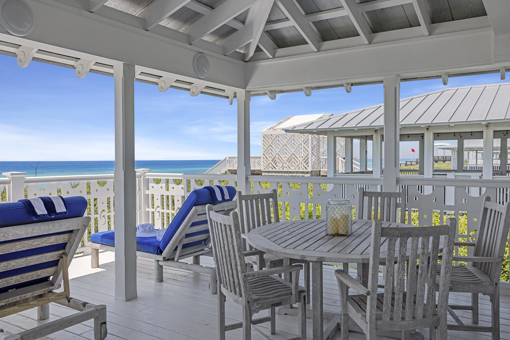2040 East County Highway 30A Santa Rosa Beach, FL 32459 - Photo 34 of 51 a view of a patio with a table and chairs