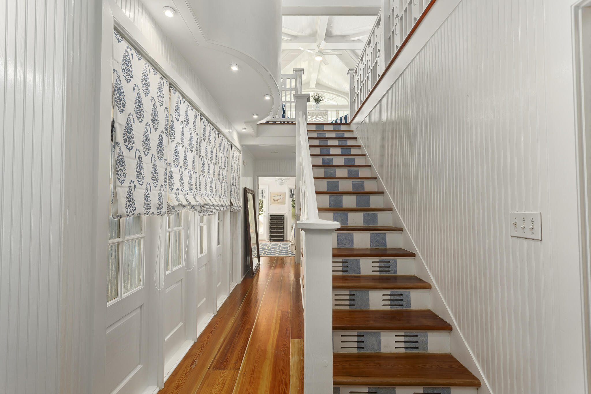 2040 East County Highway 30A Santa Rosa Beach, FL 32459 - Photo 40 of 51 a view of staircase with wooden floor and white walls