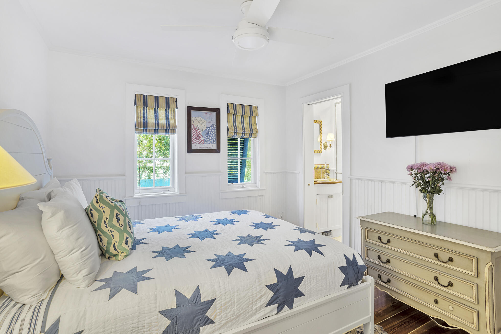 2040 East County Highway 30A Santa Rosa Beach, FL 32459 - Photo 45 of 51 a bedroom with a bed a television and a large window