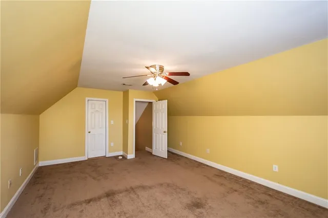 a view of a big room with carpet