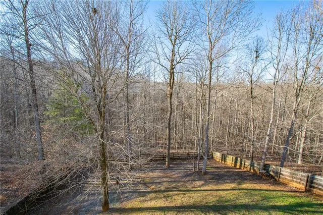 a view of house with a swimming pool