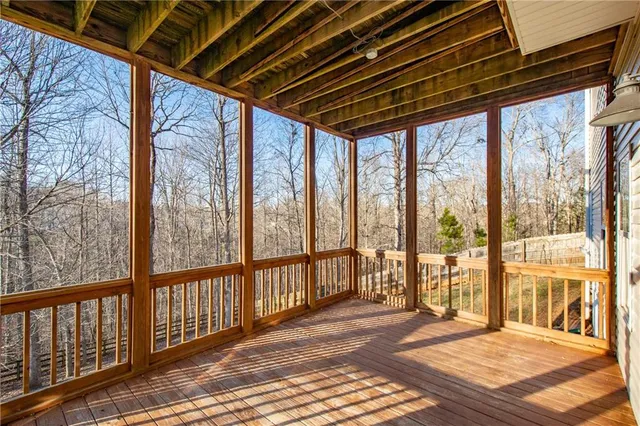a view of a balcony with wooden floor