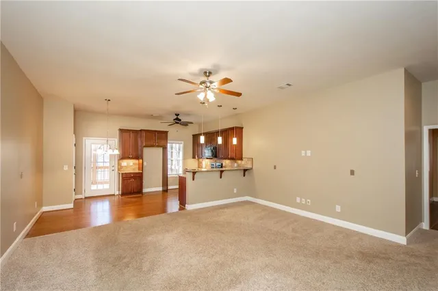 a kitchen with stainless steel appliances granite countertop a refrigerator stove and sink