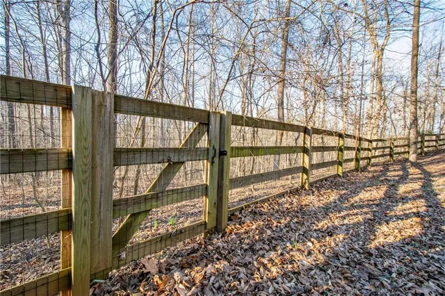 a view of house with a yard