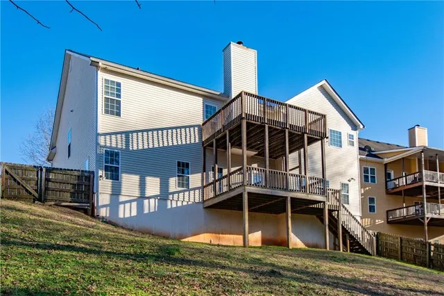 a view of swimming pool with outdoor seating and trees