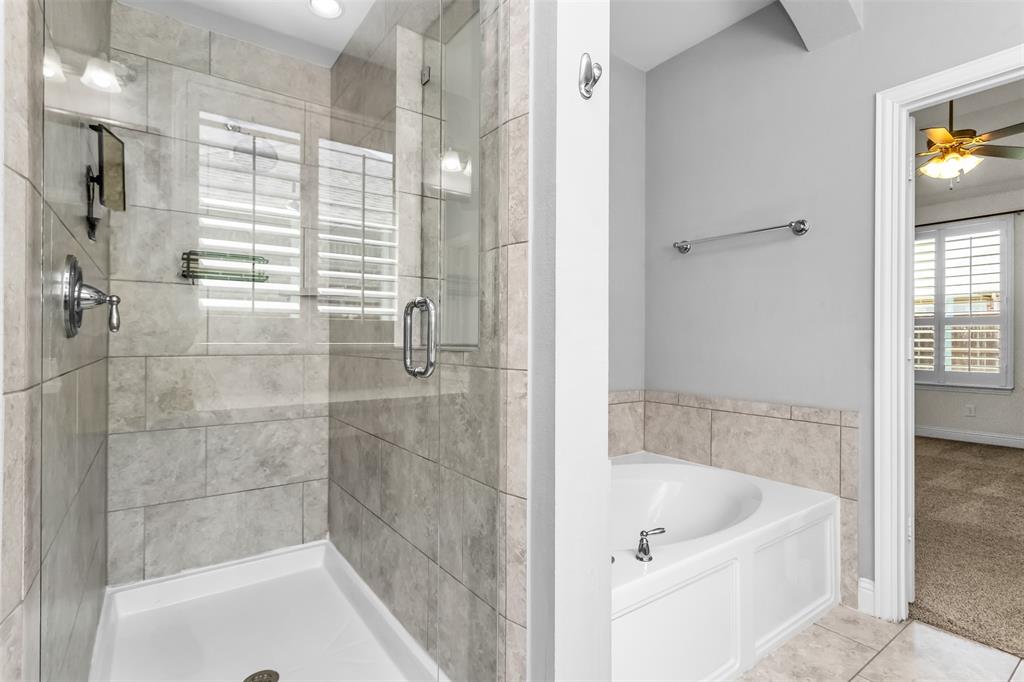 15713 Canyon Ridge Prosper, TX 75078 - Photo 24 of 38 Walk-in shower with clear glass enclosure and chrome fixtures