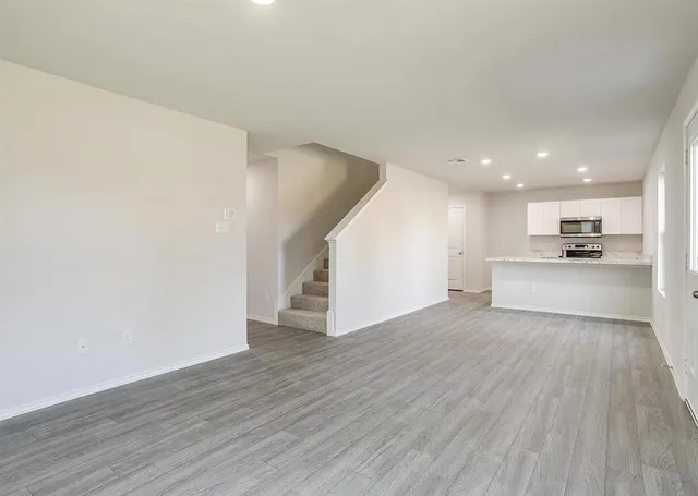 a view of kitchen with wooden floor