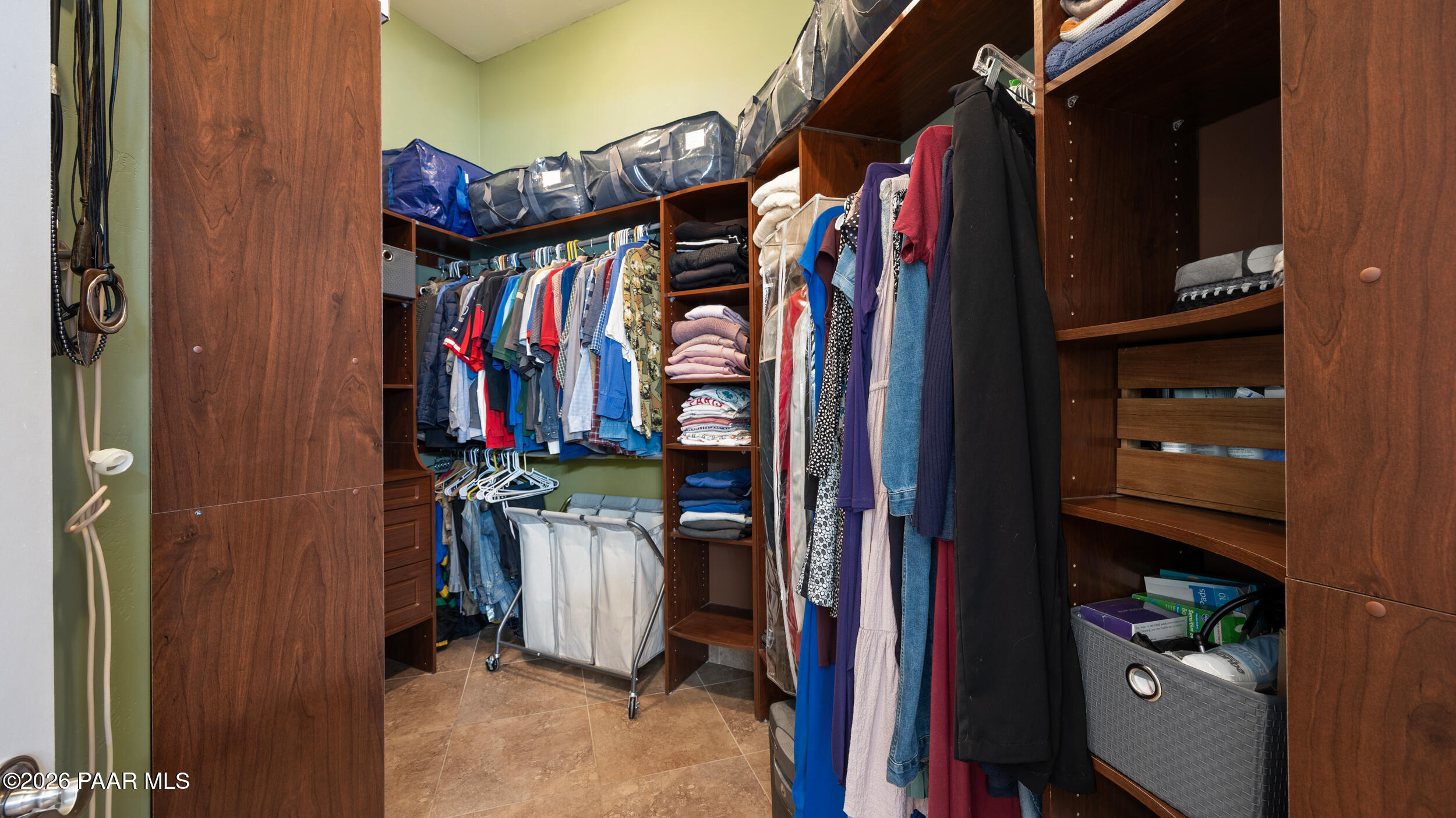 9605 North Coyote Springs Road Prescott Valley, AZ 86315 - Photo 16 of 43 a view of walk in closet with clothes and shoes