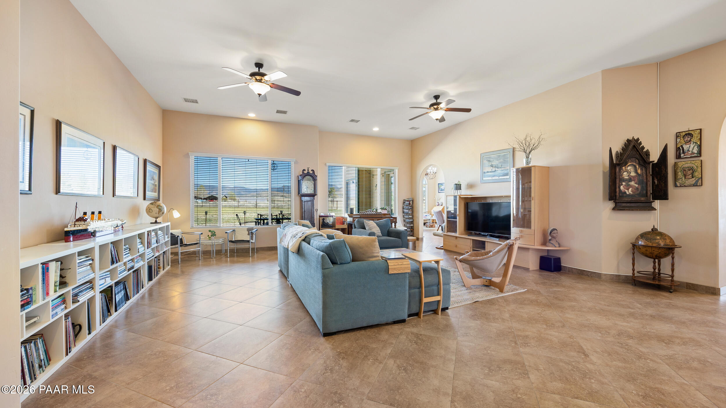 9605 North Coyote Springs Road Prescott Valley, AZ 86315 - Photo 8 of 43 a living room with furniture and a flat screen tv