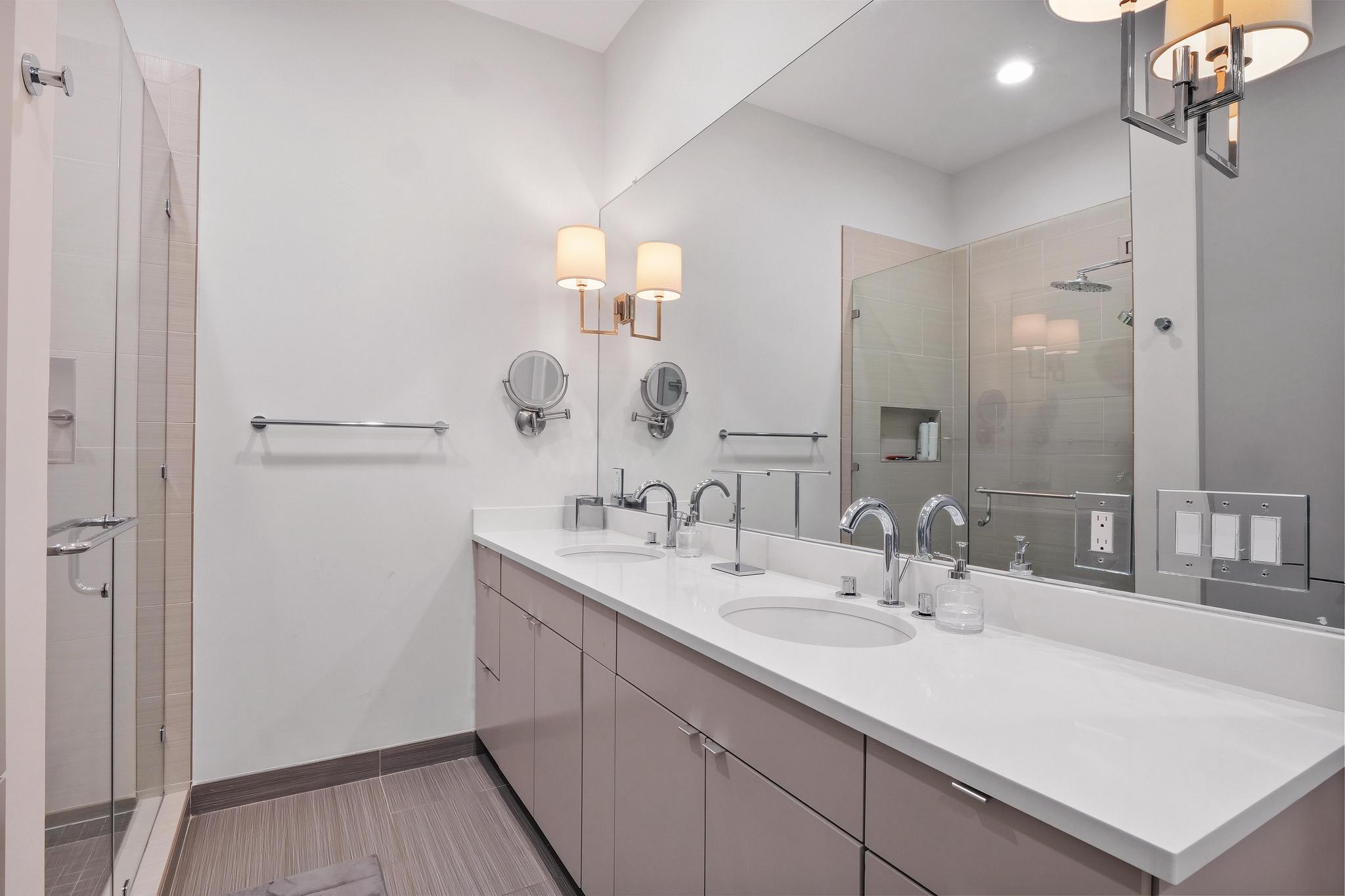 555 East 5th Street, Unit 3022 Austin, TX 78701 - Photo 30 of 40 Full bath featuring double vanity and a stall shower