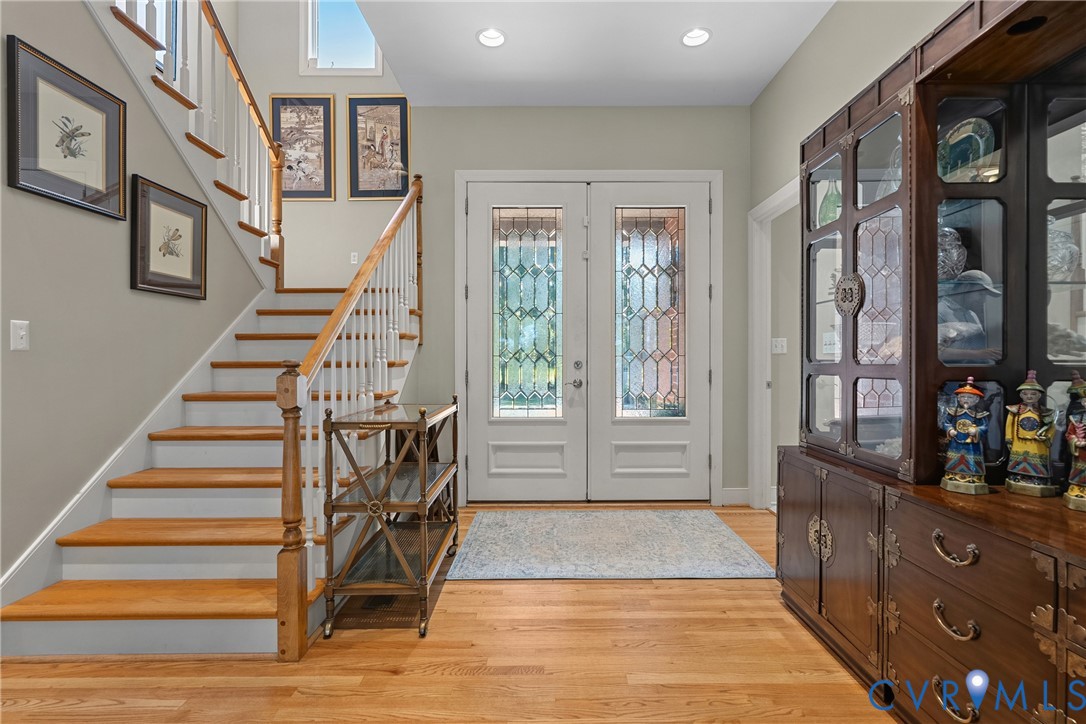 447 Tranquility Road Reedville, VA 22539 - Photo 13 of 82 Hardwood flooring, painted white staircase with wo