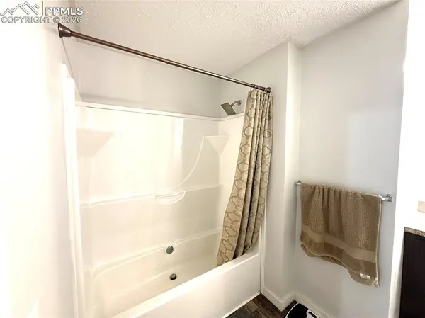 a bathroom with a shower and a tub