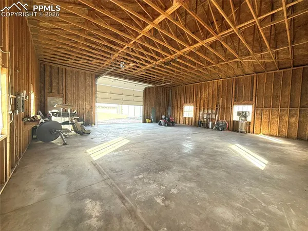 a view of a livingroom with furniture and a window