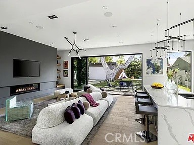 12132 Otsego Street Valley Village, CA 91607 - Photo 11 of 75 a living room with furniture and a flat screen tv