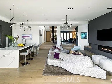 12132 Otsego Street Valley Village, CA 91607 - Photo 12 of 75 a living room with furniture and a flat screen tv